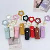 Nuevo Espejo de Maquillaje Portátil con Flor para Labial, Bolso de Labial de Moda, Regalo de Cuero, Colgante Pequeño, Llavero para Niñas