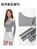 Camiseta de manga larga estilo coreano para mujer, hombros descubiertos, sexy, ajustada, con un diseño elegante, camiseta básica versátil, disponible para venta al por mayor