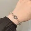 Pulseira de Cristal Super Sete Oval Natural Ouro Negro Temperamento Feminino Nicho Sensação Avançada Ano Nativo Nafu Sorte Sorte Sorte Cordão de Mão