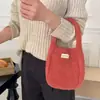 Bolso de mano suave y mullido estilo coreano para mujer, perfecto para otoño e invierno, bolso tote de punto versátil de color liso, ideal para el uso diario y salidas casuales, con correa de muñeca peluda