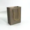 Fábrica de origem bolsa de joias corda de três fios em relevo saco de presente de papel revestido atacado spot mais impressão de logotipo