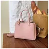 Bolsa pequena de comércio exterior transfronteiriça feminina nova estilosa casual de mão tipo balde versátil para o dia a dia bolsa de ombro único transversal texturizada