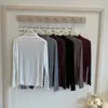 Capa base de cuello semialto con volantes, top interior elástico de manga larga ajustado para primavera/otoño, elegante top básico de punto para mujer