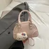Bolsa de Bolos de Gama Alta para Mujer Nueva Colección Primavera 2026 Bolso de Mano Versátil de Nicho Bolso Cruzado Mini Versátil