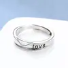 Anillo de pareja original amor hombres y mujeres anillo par letras japonesas y coreanas abierto moda nicho diseño estudiante venta al por mayor