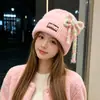 Gorro de punto estilo coreano de mezcla de lana inspirado en la dopamina con un lazo, un gorro de invierno cálido y protector para las orejas para mujer, adecuado para estudiantes