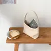 Novo estilo coreano retrô, bolsa de ombro tecida em couro PU macio, de nicho, para mulheres, moderna e sofisticada, adequada para o trajeto diário, pode ser carregada na mão ou usada sob o braço