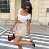 Faldas Europeas y Americanas Transfronterizas Ajustadas al Cuerpo 2026 Nuevo Verano Elegantes Accesorios Metálicos Faldas Irregulares de Cintura Alta para Mujer