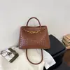 Bolso Kelly tejido con patrón vintage transfronterizo, bolso de hombro y bandolera casual de nicho para el día a día, bolso de mano moderno elegante y versátil
