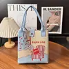 Bolsa de punto de dibujos animados transfronteriza, gran capacidad, portátil y linda, adecuada para estudiantes y trabajadores de oficina, bolsa de mano para el día a día, venta al por mayor desde el fabricante