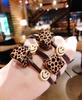 Corea del Sur Dongdaemun mismo estampado de leopardo cuadrado acrílico banda para el pelo cara sonriente alta elasticidad cuerda para el pelo cabeza de bola cuerda para el pelo negra