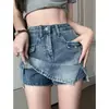 Falda corta de mezclilla con abertura para chica caliente para mujer, nuevo estilo de verano, talla grande, diseño de cintura alta, anti-exposición, línea A, adelgazante y que se ajusta a la cadera