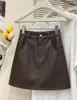 Falda de Cuero PU Lisa Estilo Europeo de Cintura Alta para Mujer Otoño Nueva Llegada Mini Falda de Línea A Adelgazante Elegante Versátil Falda que Resalta la Cadera