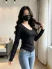 Camiseta básica para mujer para otoño e invierno, nuevo estilo coreano, top con dobladillo curvo irregular, camiseta interior sexy de manga larga ajustada
