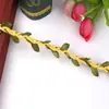 Fabricante de Yiwu al por mayor Cuerda de Hoja Artificial, Accesorios para Ropa, Cuerda Trenzada de Cera, Decoraciones de Jardín, Cuerda de Cáñamo de Hoja Verde, Enredadera