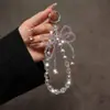 Pingente de Corrente para Celular com Laço de Cristal Super Brilhante, Exquisito e de Alto Padrão, Chaveiro Versátil Estilo Pulseira, Pingente para Pendurar no Carro Venda por Atacado