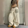 Jeans de pierna ancha holgados hasta el suelo para hombre y mujer, estilo callejero americano, con bolsillos de retazos con estampado de leopardo, dobladillo curvo, con remaches