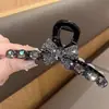 Elegante pinza de garra floral para peinado semi-recogido, nuevo modelo 2026 para mujer, pinza de tiburón de tamaño mediano para la parte trasera de la cabeza, accesorio para el cabello