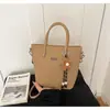 Bolso de mano de alta gama para mujer, nuevo bolso tote versátil 2026, bolso de hombro casual, bolso cruzado, bolso cubo de nicho para el día a día