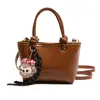 Bolso de Hombro Transfronterizo de Cuero Nuevo con Cera y Textura Retro 2025 Moda Bolso Cubo para Viajes Diarios Bolso Cruzado de Nicho Estilo Occidental