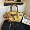 Popular Bolso de Mano Estilo Coreano para Mujer de Comercio Exterior 2026 Nuevo Bolso de Hombro Estético de Nicho Bolso Cruzado Tipo Cubo de Alto Valor