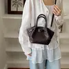 Bolso Cubo de Estilo Nuevo de Moda para Viajes Diarios Bolso de Hombro Simple de Moda para Mujer Bolso Cruzado Tejido de Nicho 2026