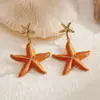 Brincos Pingente Estrela-do-Mar Exquisitos e Fashion com Gotejamento de Óleo Agulha de Prata Brincos Estilo Férias na Praia Europeu e Americano Brincos Versáteis de Personalidade para Mulheres