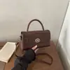 Bolso tote de PU grande de estilo coreano para viajes transfronterizos, nuevo modelo de lujo 2026 con cierre de hebilla, simple y moderno, para el día a día, bolso de hombro y bolso cruzado
