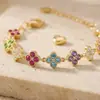 Venta Caliente Transfronteriza Nuevo Producto Pulsera Francesa Lujo Ligero Gama Alta Completamente Incrustada con Diamantes Circonita Pulsera de Trébol de Cuatro Hojas Siete Colores Joyería de Acero de Titanio