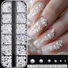 Accesorios de arte para uñas transfronterizos: Rhinestones de vidrio iridiscente AB con forma de perla media redonda y base plana, caja de tira larga de 12 compartimentos, set de rhinestones para decoración de uñas