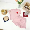 Traje Deportivo de Rayas de Manga Corta de Verano 2026 Nuevo con Lazo Ropa para Niños Nuevo Conjunto de Dos Piezas para Niños Pequeños y Medianos