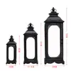 Estilo europeo hierro retro romántico adornos de candelabro lámpara de viento a prueba de viento de pie soporte para velas accesorios de boda linterna guía de camino