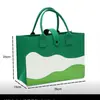 Nueva bolsa de fieltro para el Festival del Bote del Dragón logo personalizado verde tejido puntada de estilo nacional sensación de alta gama zongzi bolsa de regalo portátil