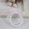 Pulsera de perlas artificiales para niños pulsera de perlas de plástico para niñas pulsera de cuentas de perlas acrílicas hecha a mano pequeño regalo joyería al por mayor de Yiwu