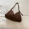 Bolsa de mão estilosa e casual com um toque único e descontraído, perfeita para o outono de 2026; uma bolsa tiracolo simples e versátil para o trabalho e o trajeto