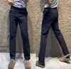 Pantalones casuales de otoño para hombre, de color liso, sencillos y elegantes, con una personalidad única, versátiles para negocios, con un tacto de alta gama y un corte ligeramente ajustado