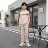 Conjunto deportivo casual de dos piezas Xiake Xiong para primavera y otoño, con diseño de bloques de color, corte holgado, con sudadera de cuello redondo