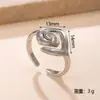 Nuevo anillo de acero de titanio estilo europeo y americano para mujer, diseño único, anillo de acero inoxidable de cadena de presión de aceite, anillo abierto que no se decolora