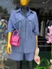 Moda Feminina Transfronteiriça Europeia e Americana Verão 2026 Novo Conjunto Casual de Camisa Listrada Solta com Bolsos e Shorts de Cintura Alta