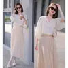 Camisa de diseño fresca azul de manga tres cuartos para mujer Verano nuevo estilo western retro suelta de alta calidad moda