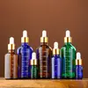 Botella de Vidrio Graduada al por Mayor para Aceites Esenciales Marrón a Prueba de Luz Botella de Relleno Cosmético Botella Gotero con Punta de Pegamento Botella de Esencia