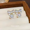 Novos Brincos de Pérola Doces para Mulheres, Design de Nicho de Luxo Leve, Brincos Versáteis, Pino de Prata S925, Tacos de Orelha Fashion de Laço
