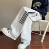 Pantalones casuales para hombre 2026 nuevo modelo estilo Hong Kong modernos holgados adelgazantes a rayas acampanados de pierna ancha pantalones deportivos de chándal ropa para hombre