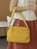 Bolsa de tela casual ligera de nicho para pedidos extranjeros para mujer 2025 Nueva bolsa versátil simple de hombro cruzada Bolsa para actividades al aire libre y ocio