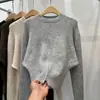 Suéter de punto casual de alta gama para mujer, nuevo diseño de otoño e invierno, cuello redondo, manga larga, dobladillo suave tipo cera con abertura, suéter de punto con temperamento