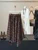 Saia midi xadrez retrô irregular para mulheres, design afunilador de cintura alta para o início do outono, saia de corte A elegante e versátil