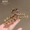 Moderna Elegante de Gama Alta Clip de Garra de Cristal Amarillo Nuevo Estilo Celebridad de Internet Clip para Moño en la Parte Trasera de la Cabeza Muestra Volumen del Cabello Clip de Tiburón