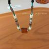 Collar de cuentas de mariposa estilo chino retro de madera y mariposa para mujer, cadena de clavícula de estilo étnico de lujo ligero y de alta gama.