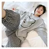 Comercio exterior estilo coreano cara sonriente primavera y otoño populares pijamas para mujer puerta sureste estampado completo cara sonriente ropa de casa se puede usar afuera