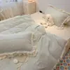 Nuevo conjunto de cuatro piezas de terciopelo de leche bordado estilo princesa con tema de encaje 2026